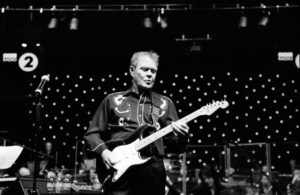 Glen Campbell performing live with electric guitar